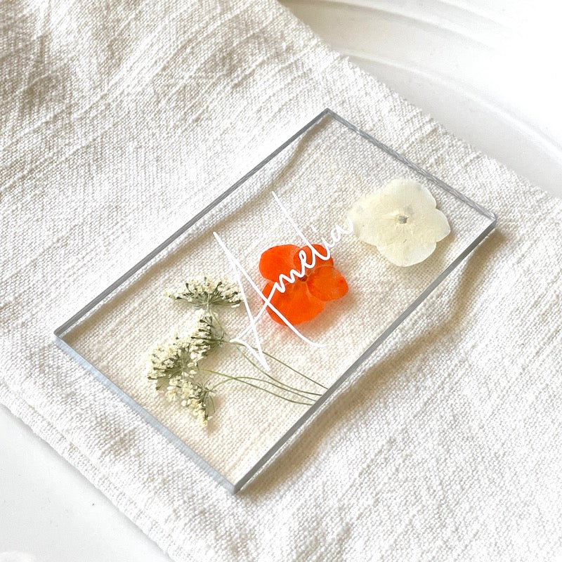 pressed orange hydrangea wedding place card closeup on napkin